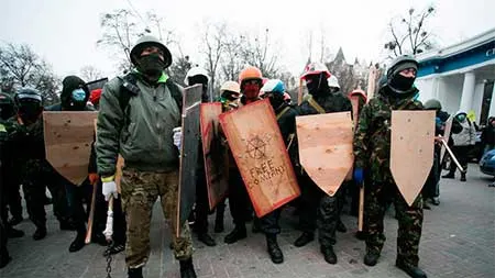 Parlamentul ucrainean cere dezarmarea grupărilor paramilitare