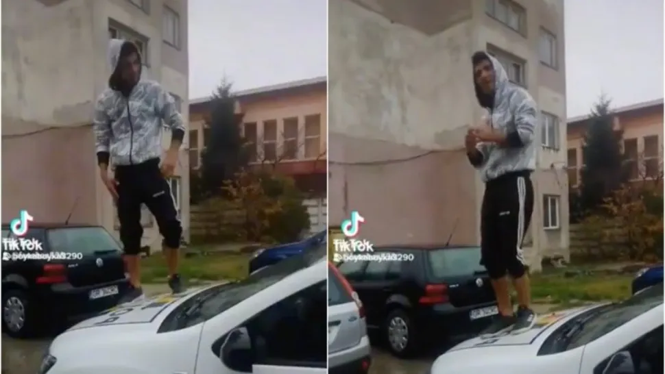 Imagini revoltătoare - Un elev dansează pe mașina de poliție