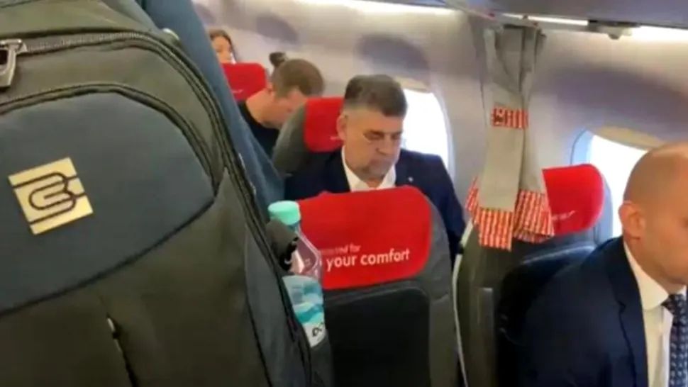 Marcel Ciolacu, filmat și fotografiat în aeroport când își ridică singur bagajele - Premierul a ales să meargă cu un avion de linie în vizita din Germania
