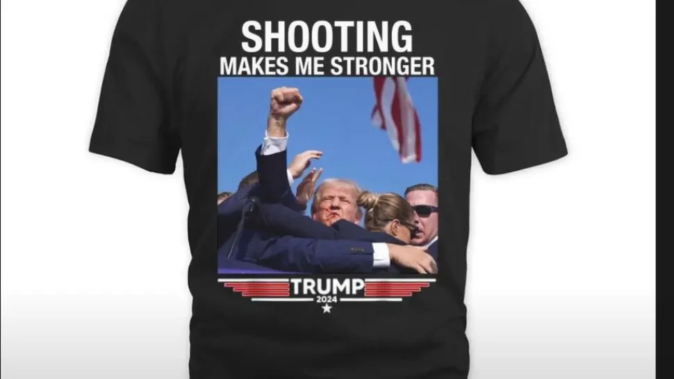 Asasinatul lui Trump. Tricourile cu mesajul „Atins, dar nu doborât!” se vând ca pâinea caldă VIDEO