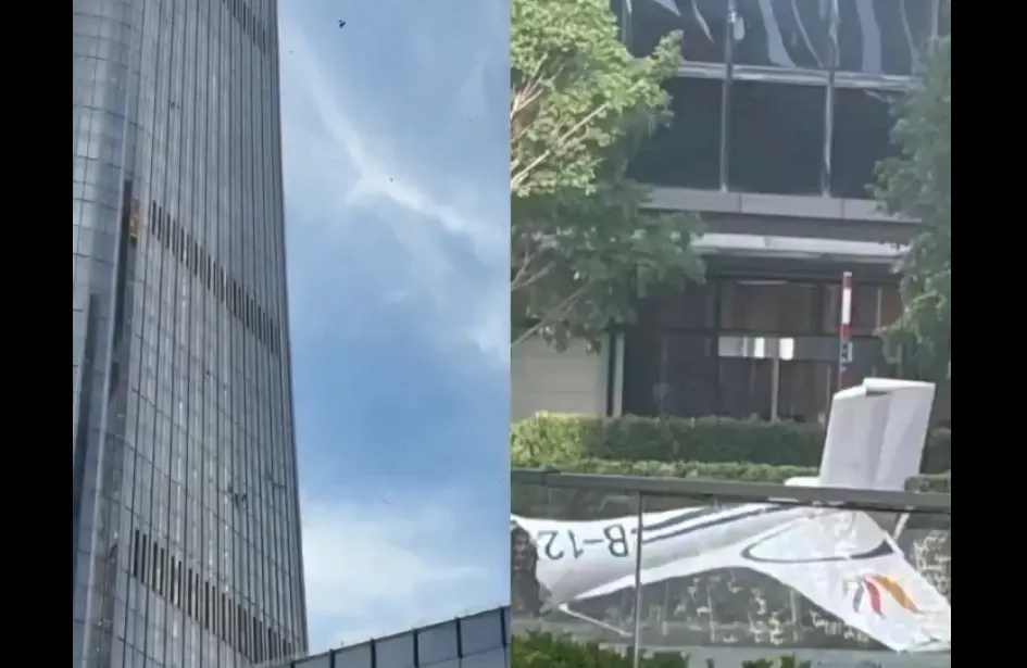 Panică în Beijing după ce un avion a intrat în plin într-un zgârie-nori. Resturile au căzut pe stradă - VIDEO