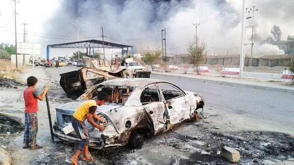 CRIZĂ în IRAK: Jumătate de milion de refugiaţi din Mosul, militari executaţi la Kirkuk