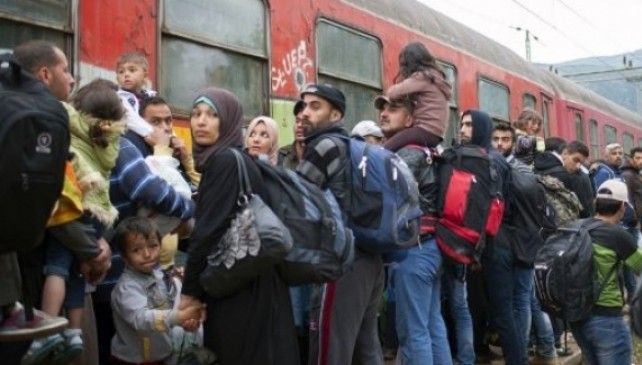 Ministrul de Interne german cere limitarea numărului de refugiați