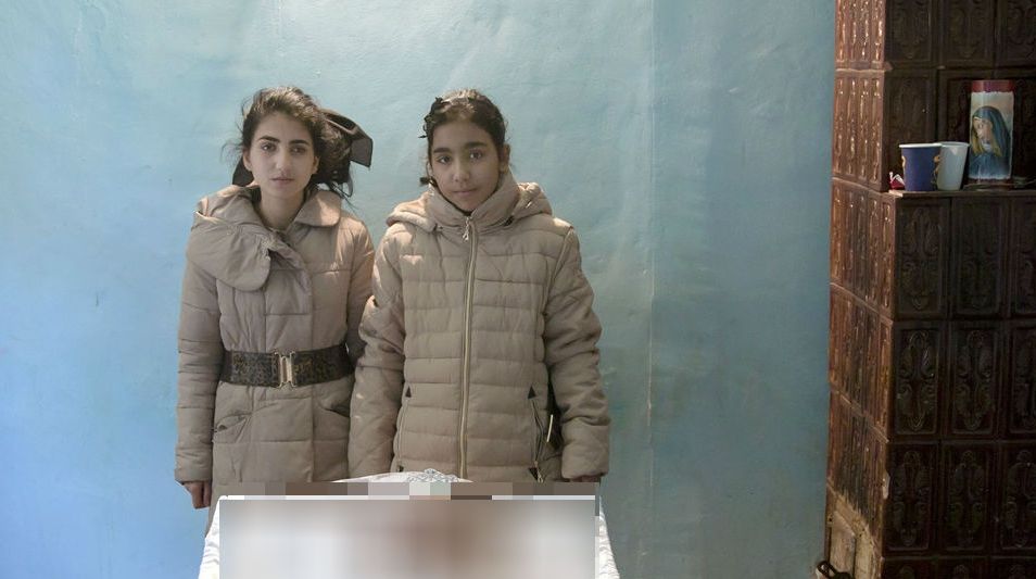 O poză de la priveghiul femeii de serviciu din Colectiv, la ”fotografiile zilei” din presa străină