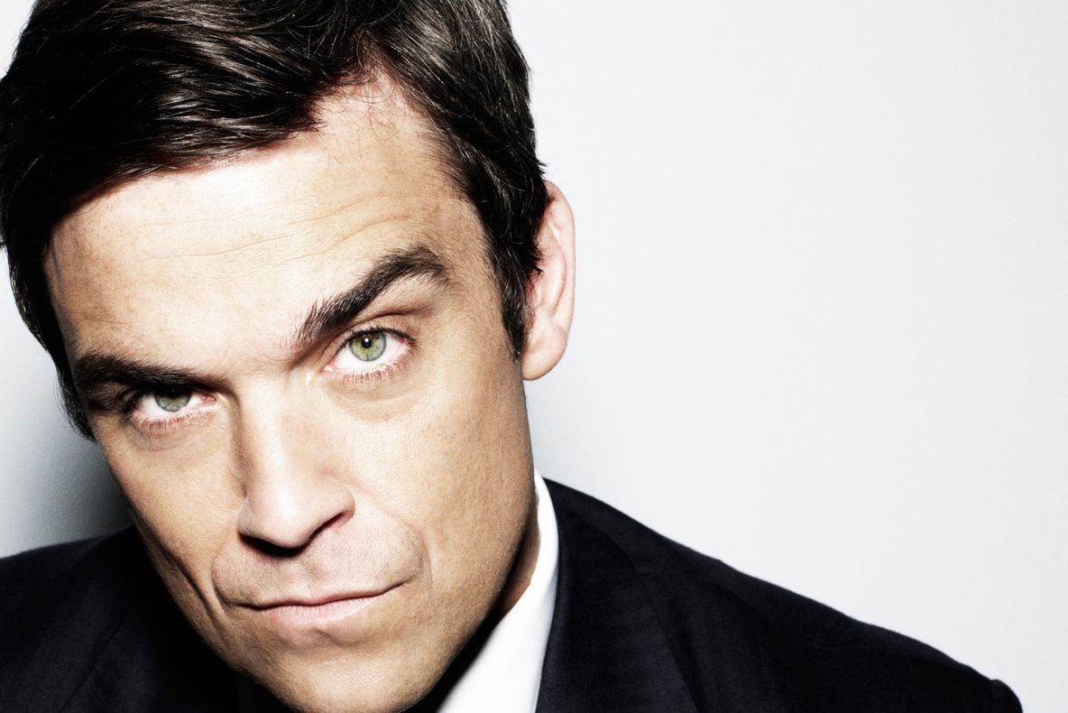 Robbie Williams a pozat nud pentru coperta revistei "Attitude"