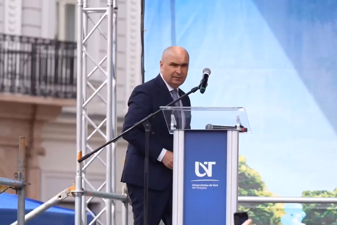 Premierul demis Ilie Bolojan își mută campania electorală mascată la Universitatea de Vest din Timișoara