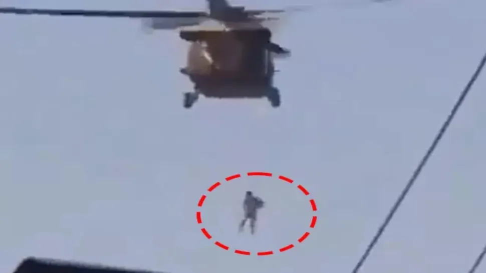 Barbat legat de elicopter