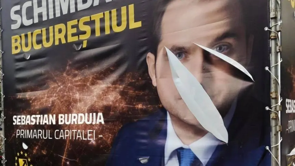 Panou vandalizat cu Sebastian Burduja