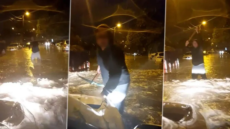 Haos total în București după furtună. Un șofer și-a continuat drumul prin inundații, deși a fost avertizat de un bărbat ce ținea un târnăcop în mână