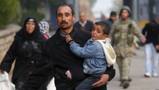 Ministrul german de Interne cere limitarea numărului de refugiați