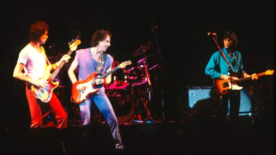 John Illsley, Mark Knopfler and Jack Sonni, la un concert în Hamburg în 1985/Profimedia