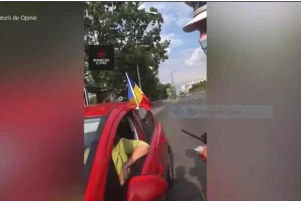 Femeie oprită în trafic de polițiști din cauza unui steag arborat la un geam al mașinii. Motivul: gabaritul a fost depășit!