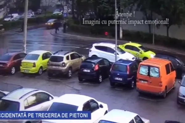 Imagini șocante - Tânără spulberată pe trecerea de pietoni de un taxi - Femeia a scăpat ca prin minune