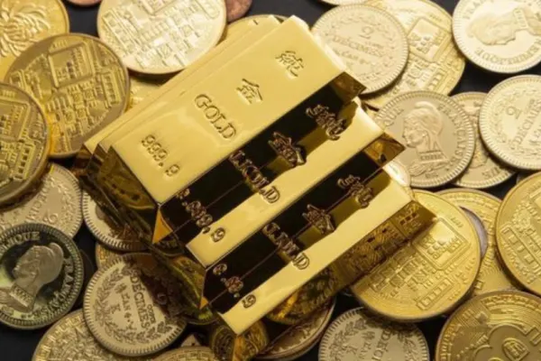 Prețul aurului, un nou RECORD în timp ce dolarul scade