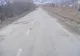 O porţiune a drumului Comăneşti din judeţul Bacău, plină de gropi