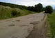 Drumul către comuna Grajduri din Iaşi, pavat cu gropi