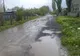 După o ploaie torenţială, nu se mai poate circula pe o stradă din judeţul Ilfov