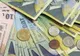 Leul fluctuează în apropiere de 4,2150 lei/euro, pe o piaţă liniştită