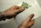 Vicepreședintele CJ Caraș Severin, reținut de DNA, pentru luare de mită de 20.000 de lei