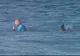 Imagini spectaculoase. Un surfer este atacat de doi rechini în timpul unei competiţii sportive