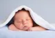 Și-a pus bebelușul în pat și i-a făcut poze. Cei care le-au văzut au rămas muți de uimire