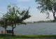 Focuri de armă pentru oprirea unui șofer în București. Mașina a plonjat în lacul Colentina