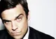 Robbie Williams a pozat nud pentru coperta revistei "Attitude"