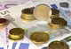 Leul, doborât de euro și de moneda americană 