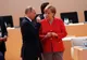 Putin i-a spus doar câteva cuvinte. Merkel, reacție bizară. Misterul se adâncește VIDEO