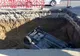 GALERIE FOTO. Un șofer a căzut cu mașina într-o groapă adâncă de cinci metri peste un muncitor