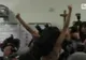 Alegeri în Italia. O femeie a protestat topless, când vota Berlusconi. Ce şi-a scris pe corp
