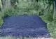 VIDEO Asfaltare în bătaie de joc în Argeș, bitum aruncat direct pe iarbă