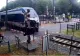 VIDEO Femeie, la un pas să fie lovită de tren, după ce a traversat linia ferată deși bariera era lăsată. Scene ȘOCANTE 