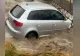 VDEO Șofer, la un pas să-și piardă viața! Mașina sa a fost luată de ape și răsturnată