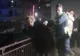 Femeie încătușată după un scandal monstru în magazin. A vrut să bea șampanie gratis și a agresat vânzătoarea