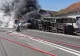 Accident teribil în Hunedoara. Un TIR încărcat cu mașini noi s-a răsturnat peste o casă, toate autoturisme au luat foc - GALERIE FOTO