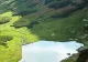 Misterul lacului natural care are forma României. De ce se tem oamenii să se scalde în apele lui?