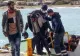 Scandal uriaș în Grecia: migranți mascați folosiți de poliție pentru a‑i goni pe alți refugiați înapoi în Turcia – VIDEO