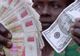 Zimbabwe renunţă la propria monedă cel puţin un an, din cauza problemelor economice grave