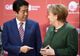 Angela Merkel și premierul japonez Shinzo Abe, împunsături la adresa politicii lui Trump