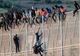 Sute de migranți au pătruns în UE sărind gardul în enclava spaniolă Melilla, din Maroc
